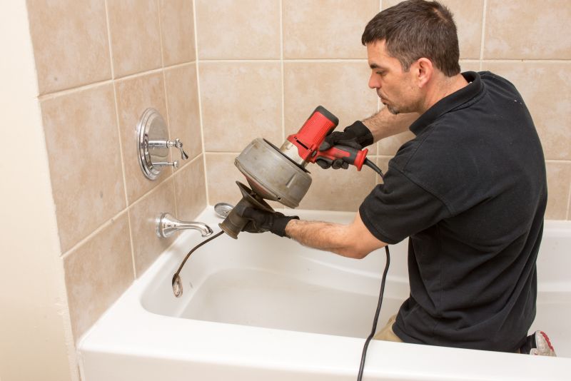 Plumber Installing Bathtub